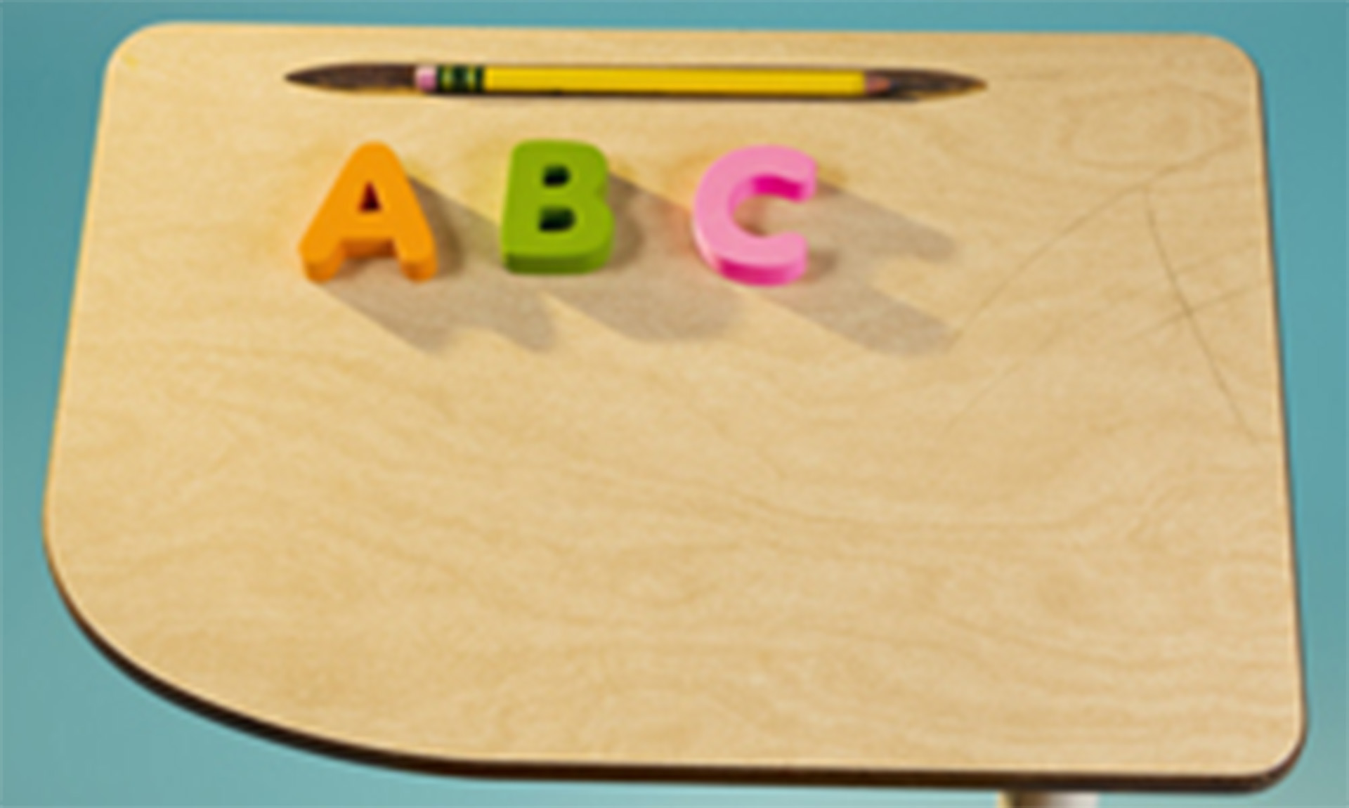 A pencil and plastic letters sit on a small wooden desk. The letters are the letter A, the letter B, and the letter C.