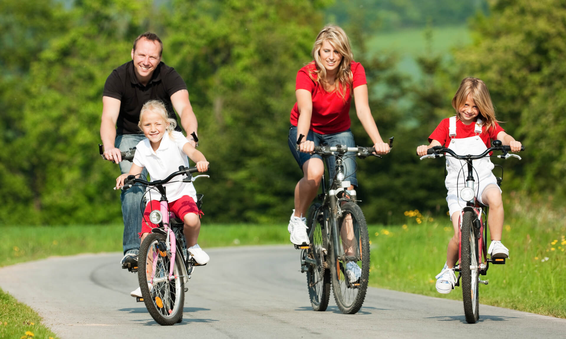 Family on a bike ride together.