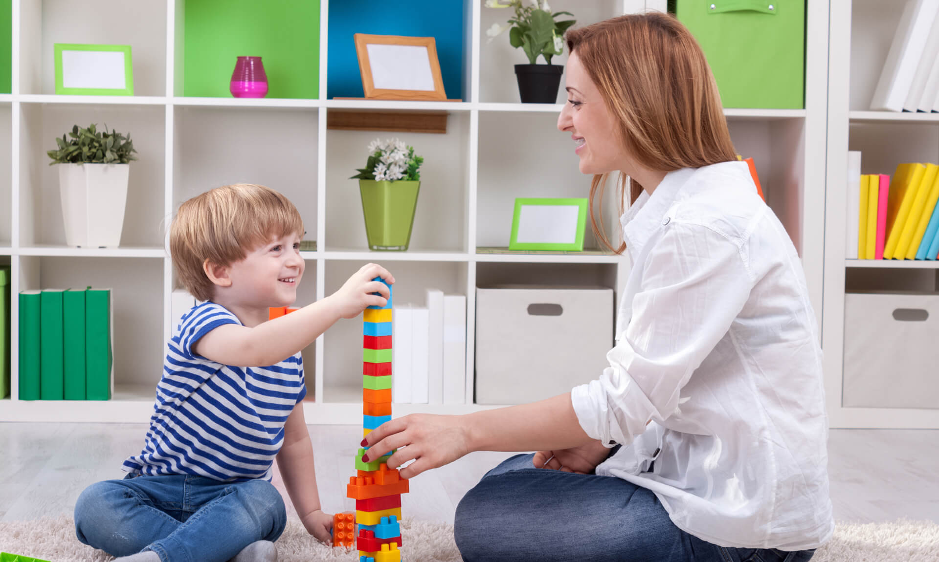 Is My Child Dyslexic Mom and son playing with blocks on the floor.
