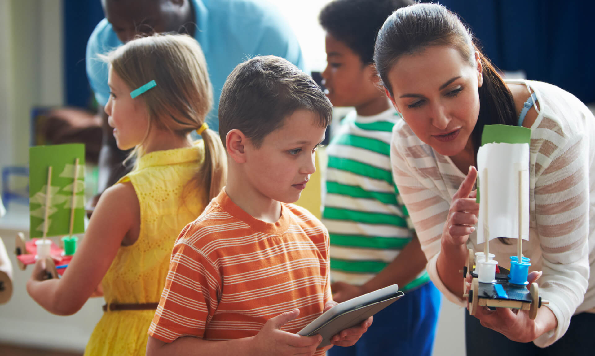 Group Of Children Carrying Out Experiment In Science Class